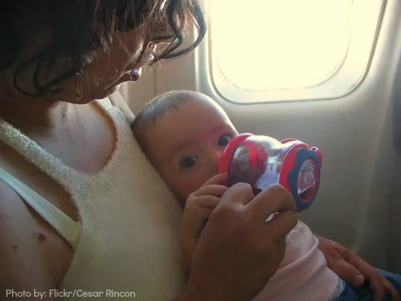 baby eating on plane