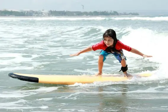 bigstock-Little-Boy-Learn-To-Surf-At-Oc-95266904