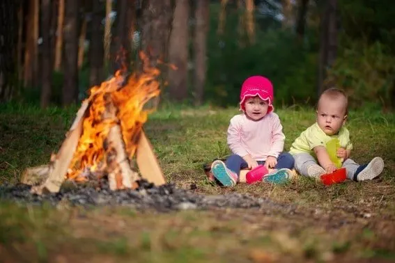 Be careful of the fire when camping with a baby