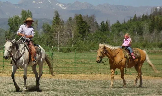 Family horse riding at The Home Ranch in Clark, Colorado