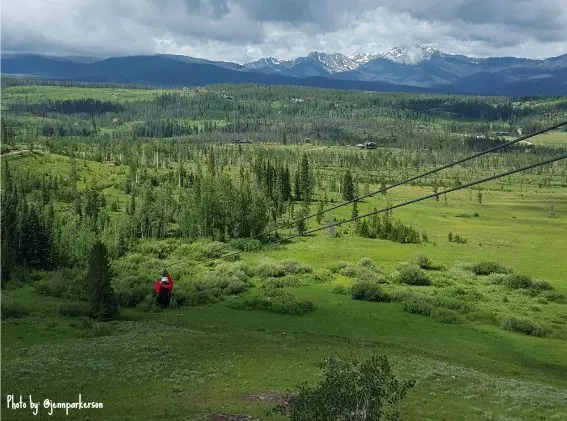 Ziplining at Devils Thumb Ranch Colorado? You bet! Adventurous families can ZOOM through breathtaking vistas together! Explore more tips on a summertime vacation in Winter Park, Colorado! #winterpark