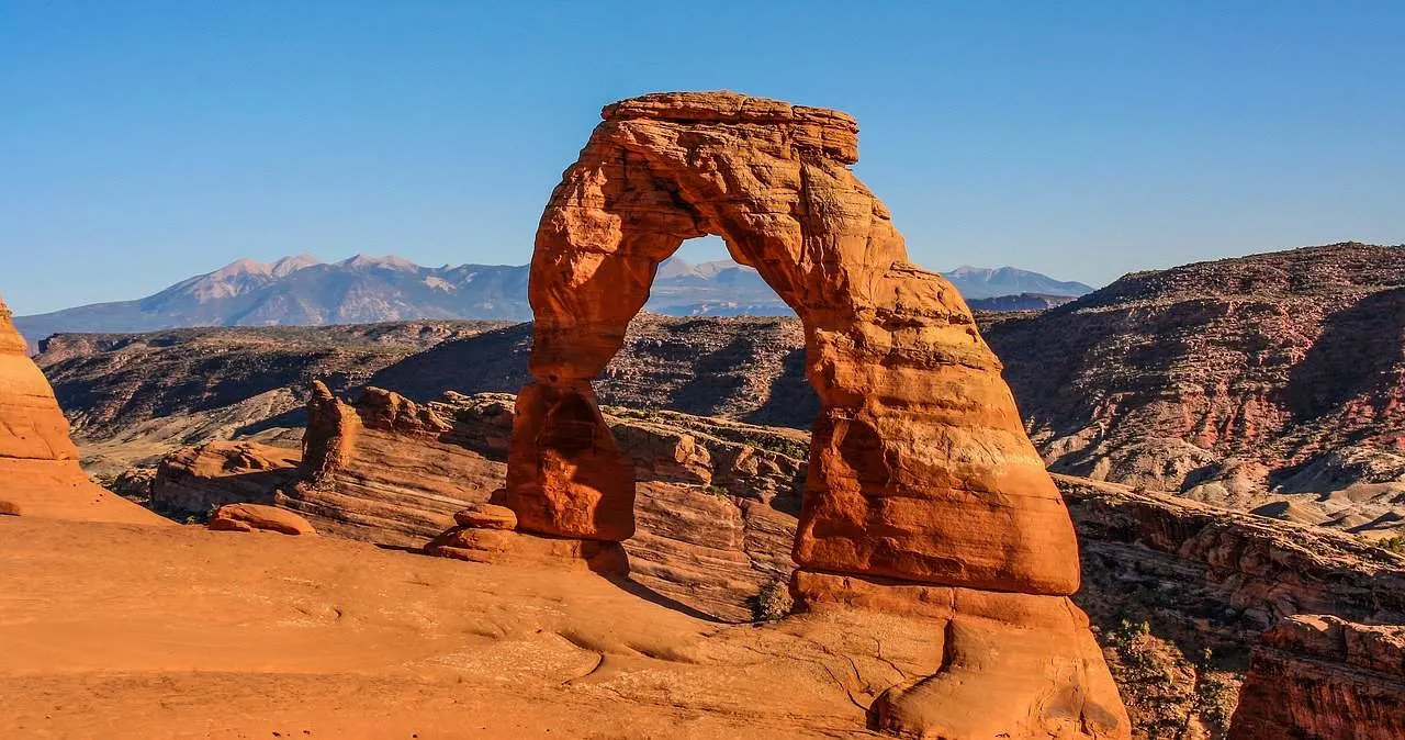 Hiking to Delicate Arch is a top thing to do in Arches National park with kids