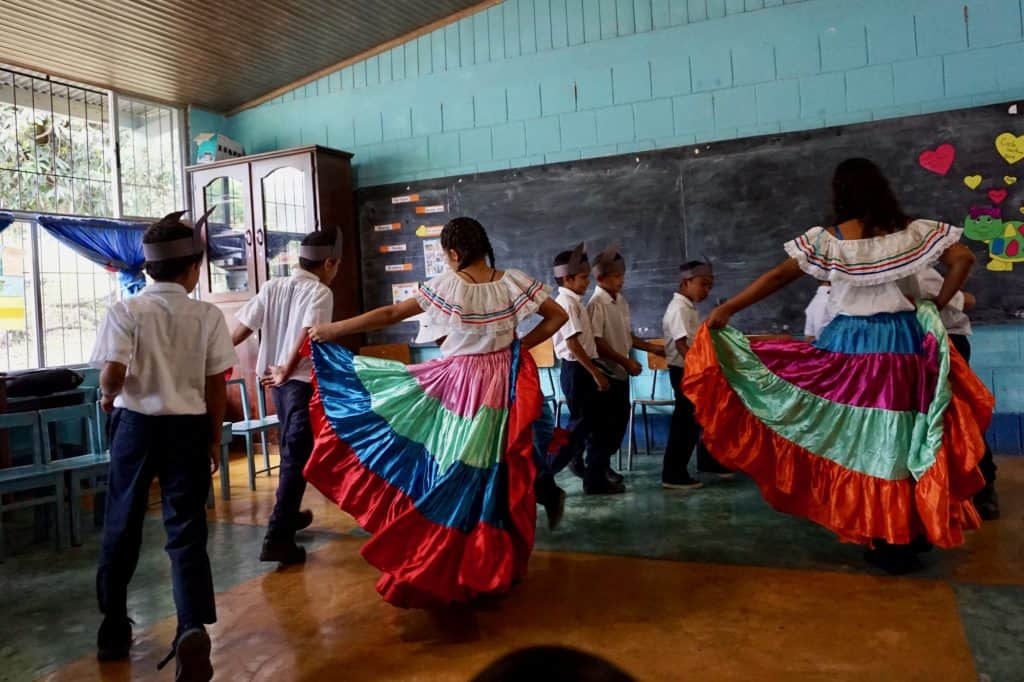 20 Incredible Things to Do in Costa Rica with Kids on a Costa Rica Family Vacation 15 Costa Rica School Visit Kids Dancing