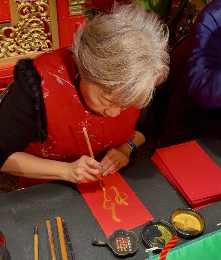 The Disneyland Resort Rings in the Lunar New Year with Food, Celebration, and Entertainment 3 Chinese calligraphy artist