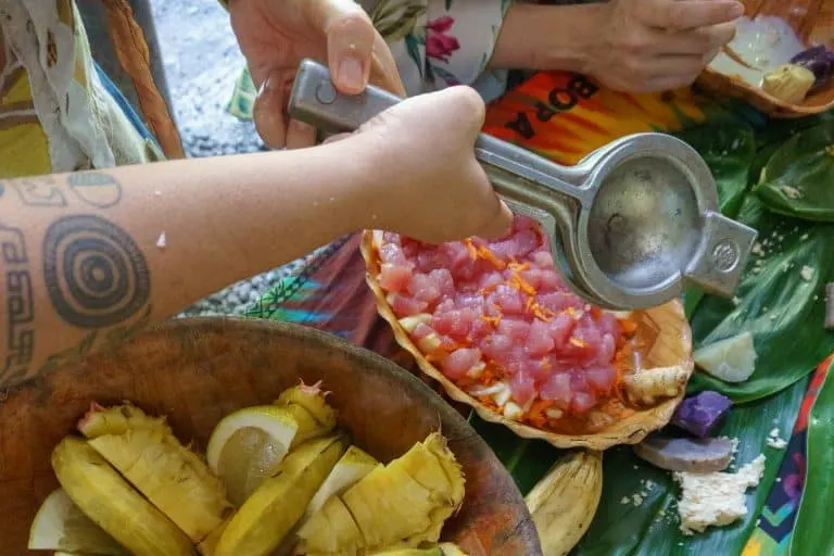 Moana cooking up a traditional Tahitian meal