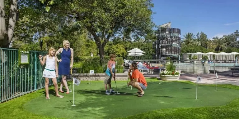 Things to do in scottsdale with kids Family at Putting Green at Hyatt Regency Scottsdale Photo Credit Visit PhoenixHyatt Regency Scottsdale Resort & Spa at Gainey Ranch