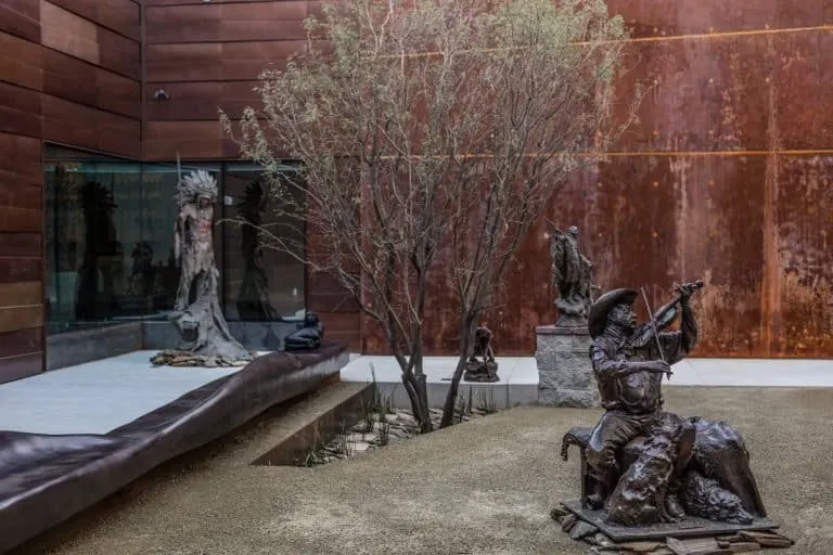 The sculpture courtyard at Western Spirit Scottsdale's Museum of the West features eco-friendly weeping wall. Credit Chad Ulam