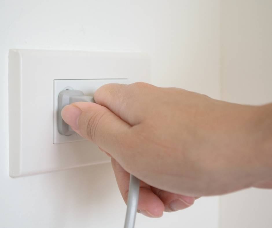 Your house checklist before vacation should include unplugging small appliances. 
