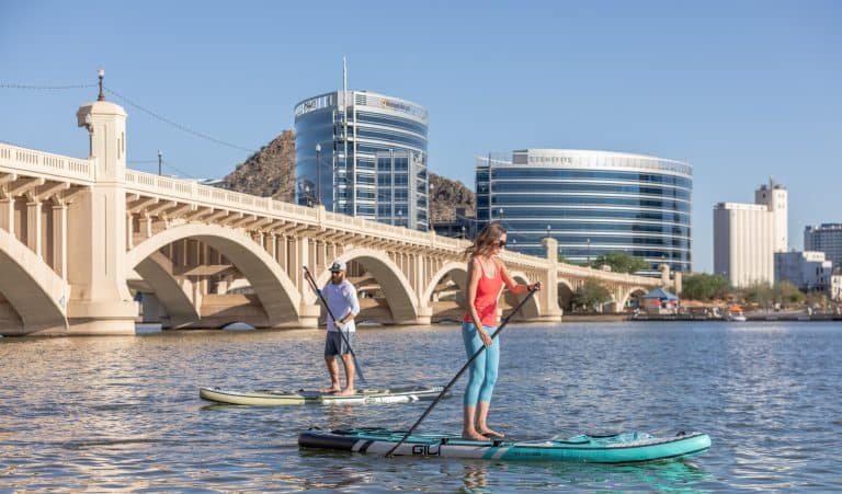oen of the best things to do in Phoenix with teens is paddleboard Tempe Town Lake
