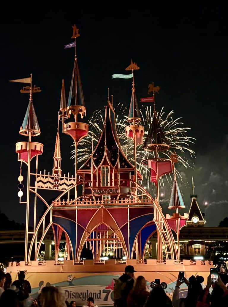 Fireworks behind the glass panel sculpture of Sleeping Beauty Castle